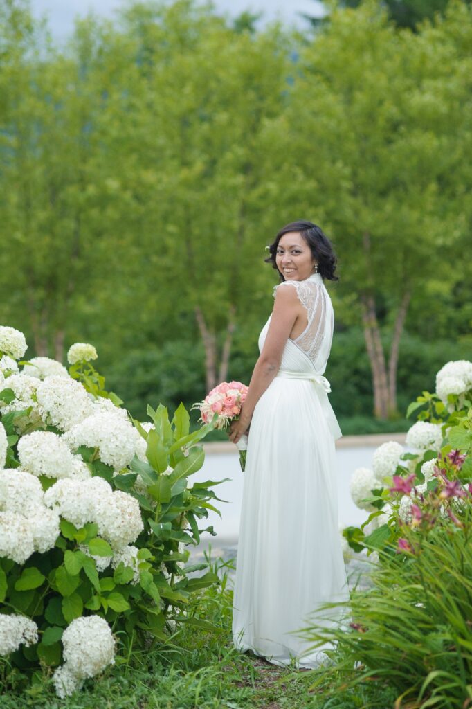 bride in white wedding dress in nature
