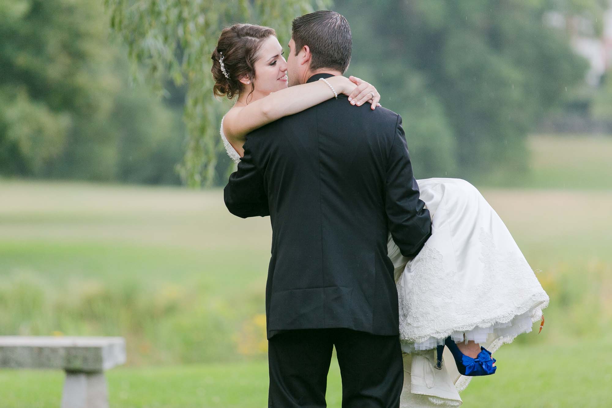 Groom Carrying Bride Pierce House Wedding