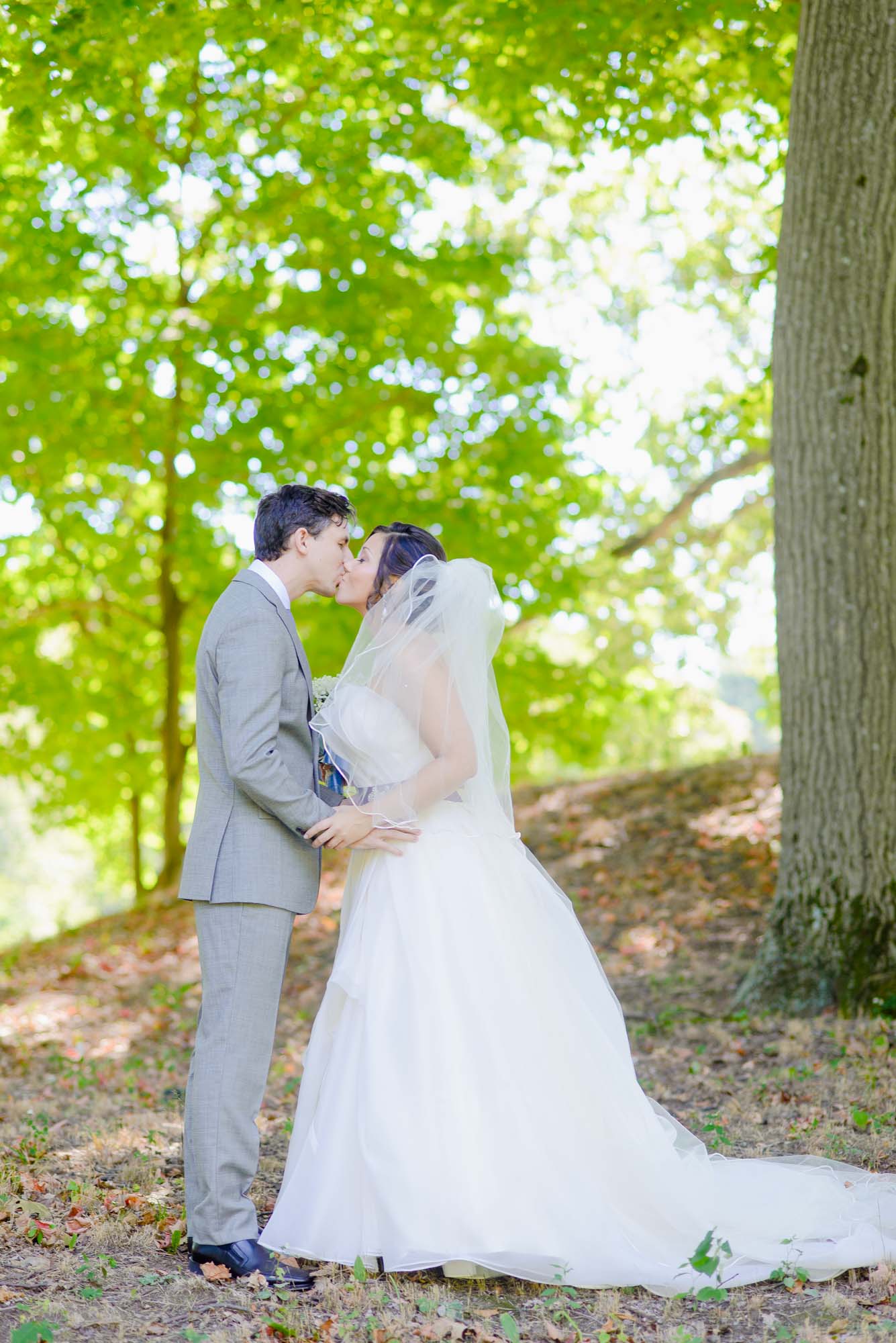 Lyman Estate Wedding Couple Kiss On Hill