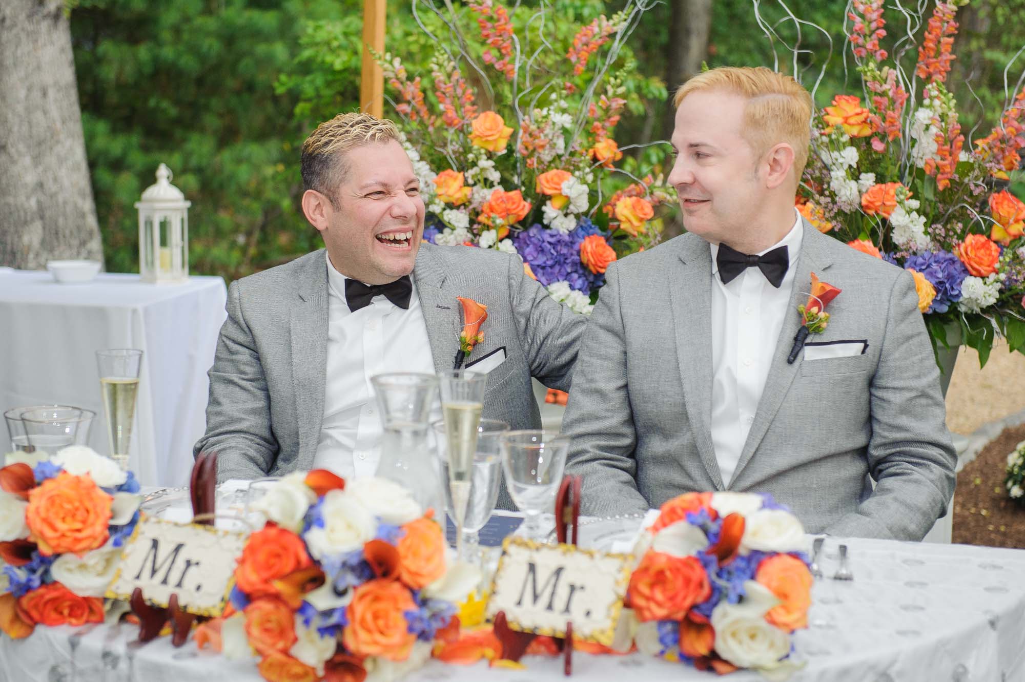 MA Backyard Queer Wedding Grooms Laughing Reception Fall Colors