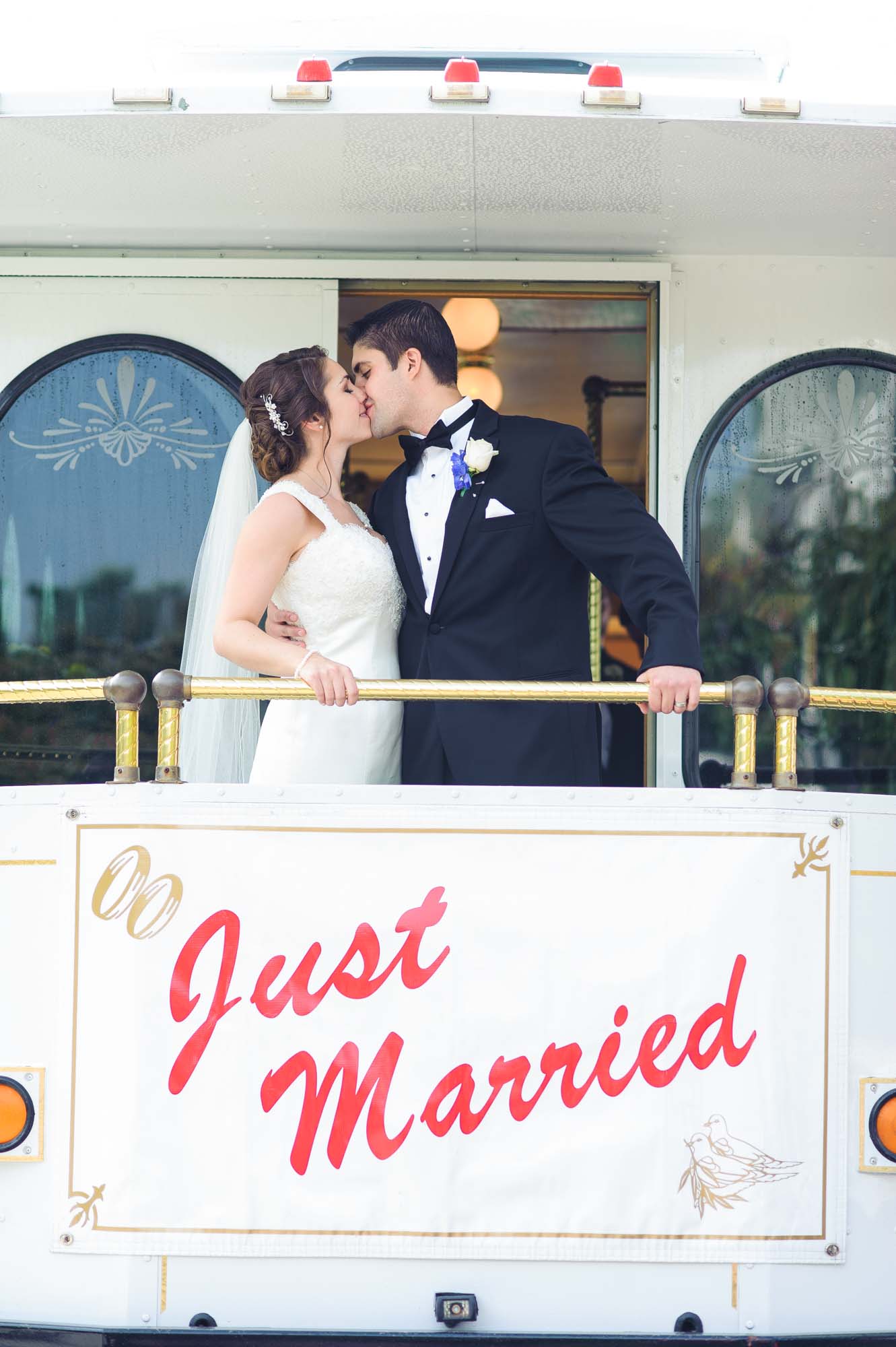 Bride Groom Kissing On Just Married Trolley