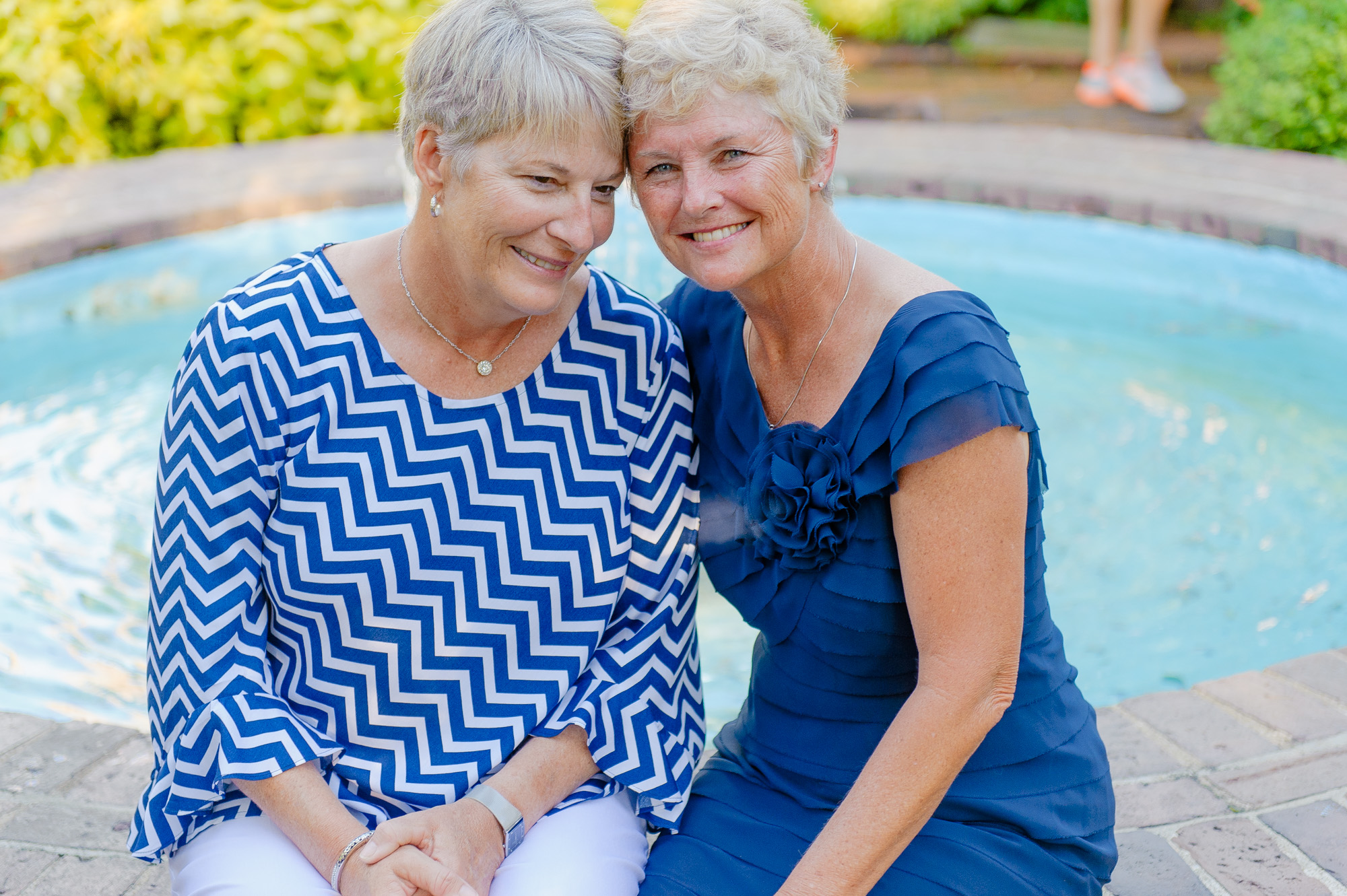 Lesbian LGBT Couple Portrait In Front Of Pond