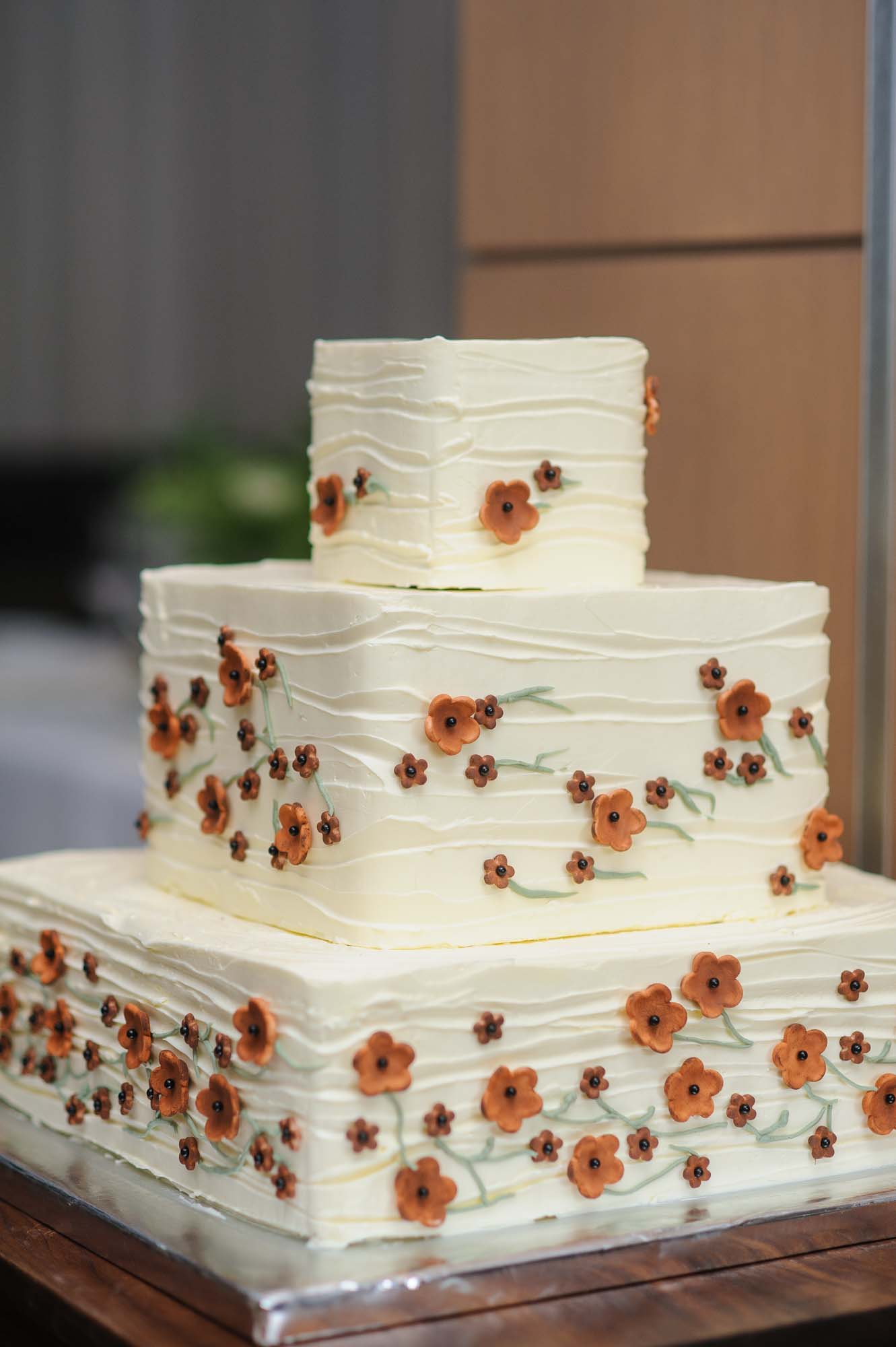 Minimalist Wedding Cake With Orange Flowers